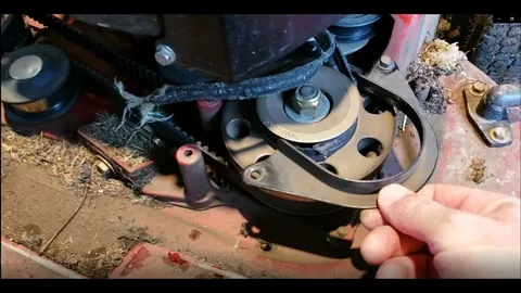 this is a image of lawn mower before belt and pully repair